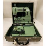 A Sew-Queen 240v portable sewing machine in carry case (flex cut off)(saleroom location: L05)