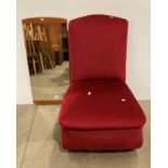 A maroon dralon upholstered low nursing chair (saleroom location: kit area)