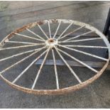 A large cast metal 20 spoke wheel,