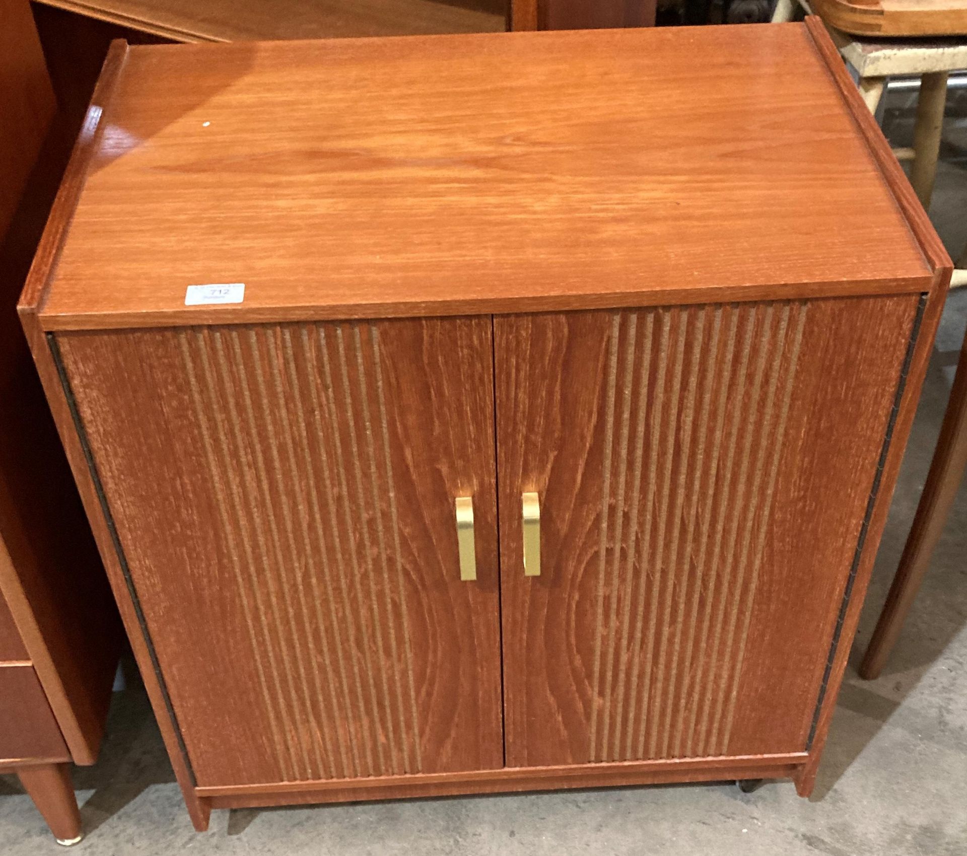 A teak two door mobile record cabinet - 64 x 42 a 69cm high (saleroom location: MS)