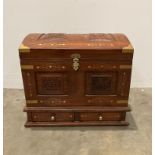 Wooden domed top storage chest with carved panels to top and front with brass inlaid sections,