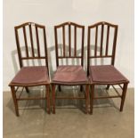Three mahogany ladder back dining chairs with purple padded seats (saleroom location: kit area)