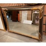 Ornate gilt and blackened gilt framed wall mirror 68 x 107cm (saleroom location: Gallery)