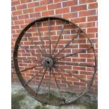 A large cast metal 16 spoke wheel,