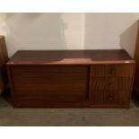 Mahogany finish wall unit comprising three drawers and fall front bureau section with writing slope,