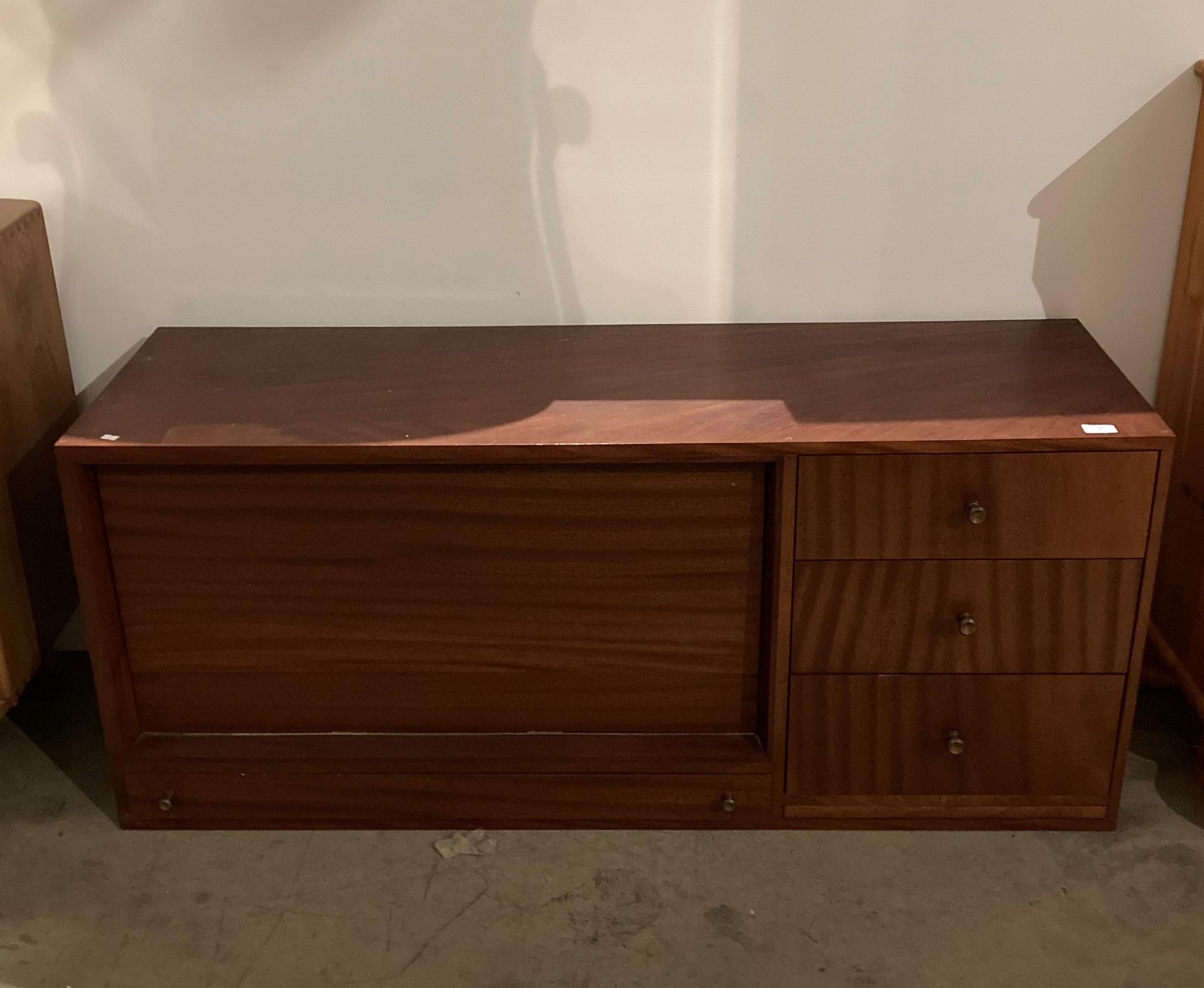 Mahogany finish wall unit comprising three drawers and fall front bureau section with writing slope,