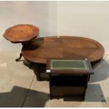 A wood finish oval coffee table,