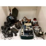 A Kodak Brownie Eight-61 projector in case and assorted cameras by Ensign, Polaroid, Kodak,