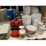 White and red plastic and porcelain bowls, plates, terrines,