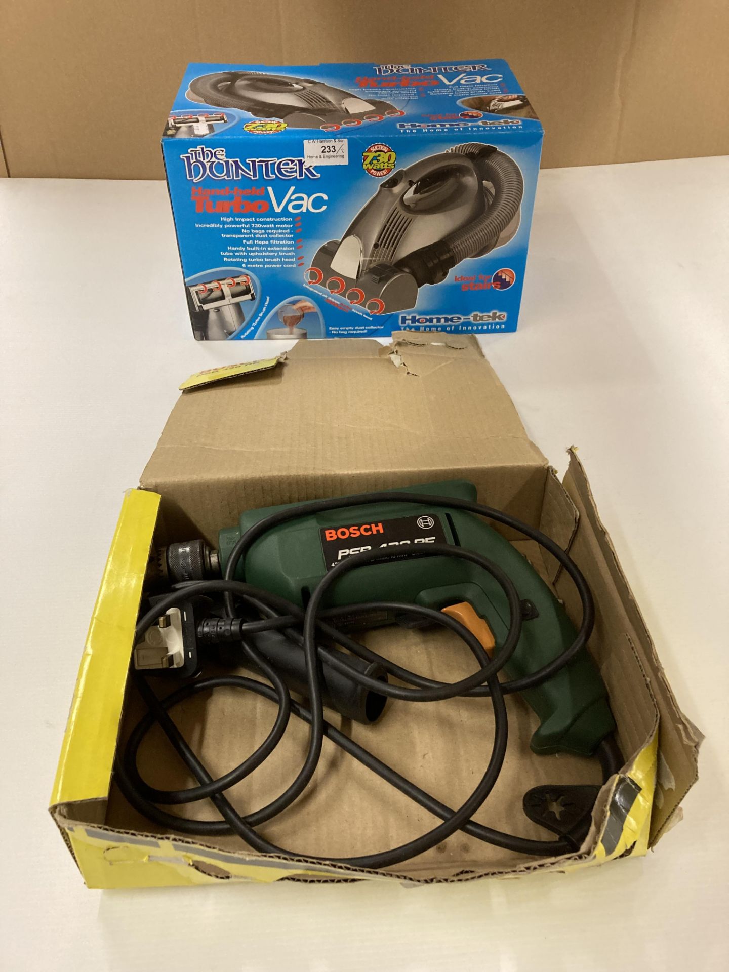 Two items Bosch - PSB 420 RE 240v hammer drill and the Hunter hand-held turbo vac 240v (saleroom