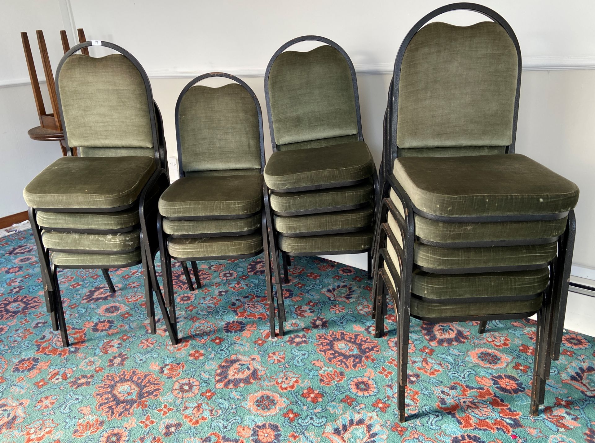17 x Green fabric metal frame stacking chairs and 3 assorted circular wooden bar tables.