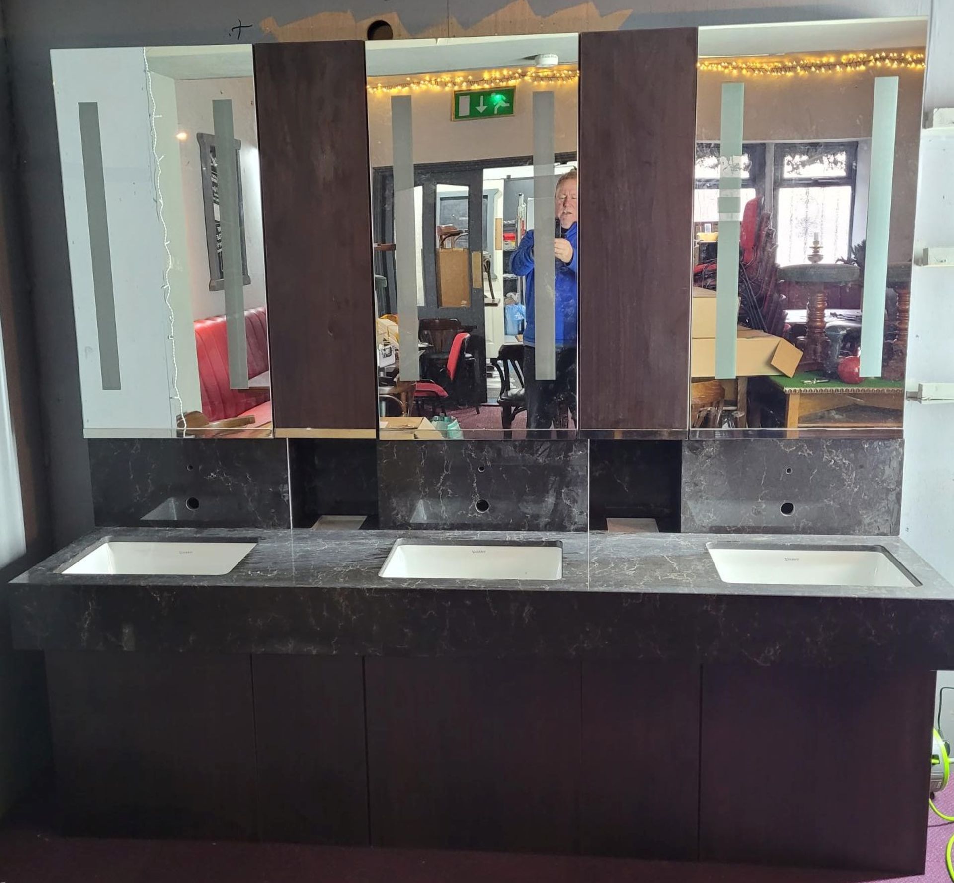 Bespoke triple basin black variegated granite bathroom sink unit, with mirrored cabinets,