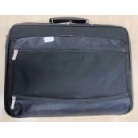 A large Toshiba laptop/briefcase with multiple compartments for electrical items,
