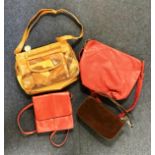 A collection of brown and red coloured bags including mini corduroy handbag and 'Indigo' cross body