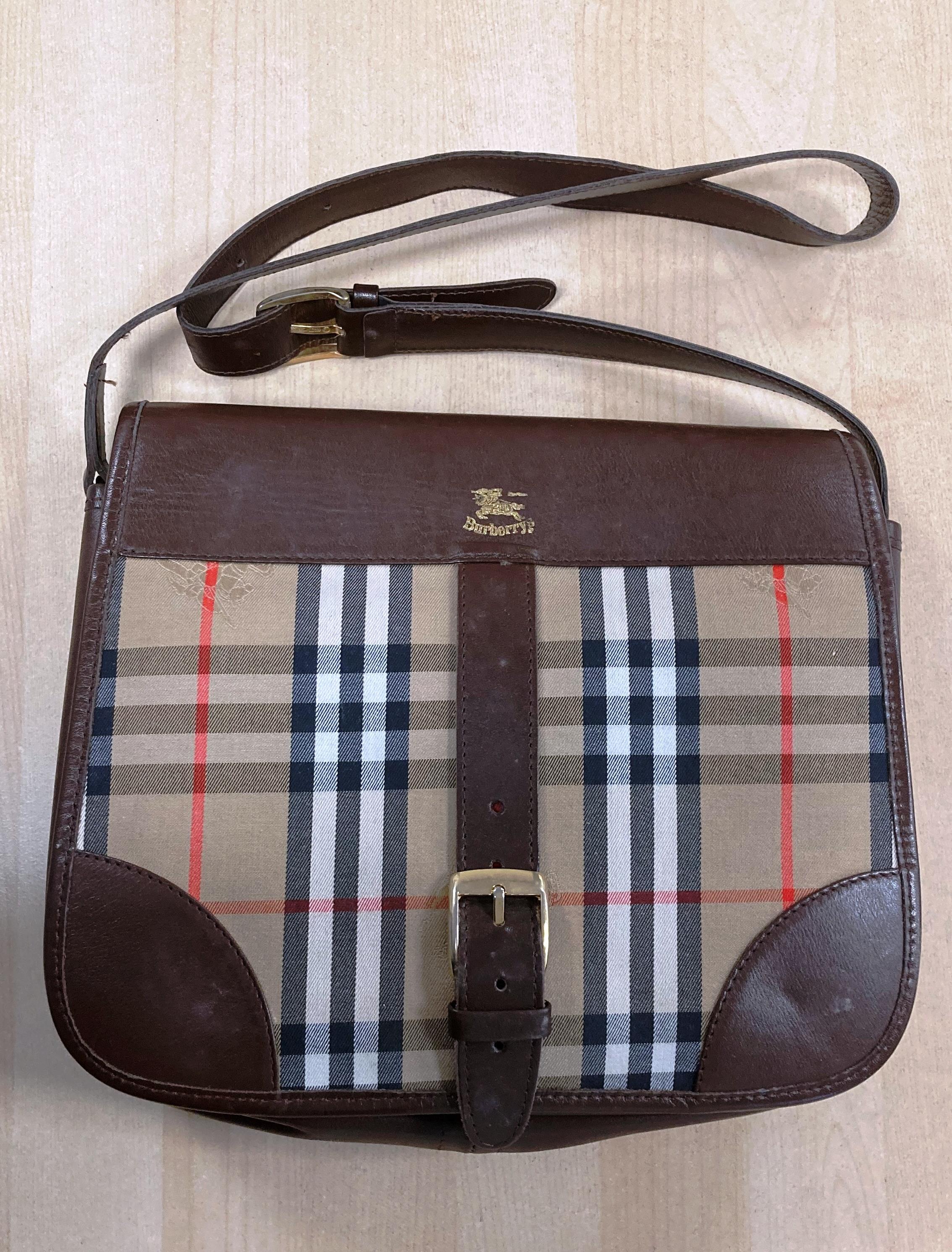 A vintage Burberry shoulder bag with brown leather and iconic Burberry tartan print with gold-tone