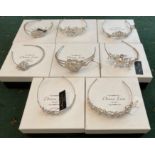 Eight boxed tiaras by Donna Lisa Bridal.