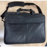 A large Dell laptop case/briefcase with multiple compartments and a folder of PC installation