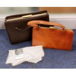 Two leather bags including a real leather bag and one unbranded bag with multiple internal pockets