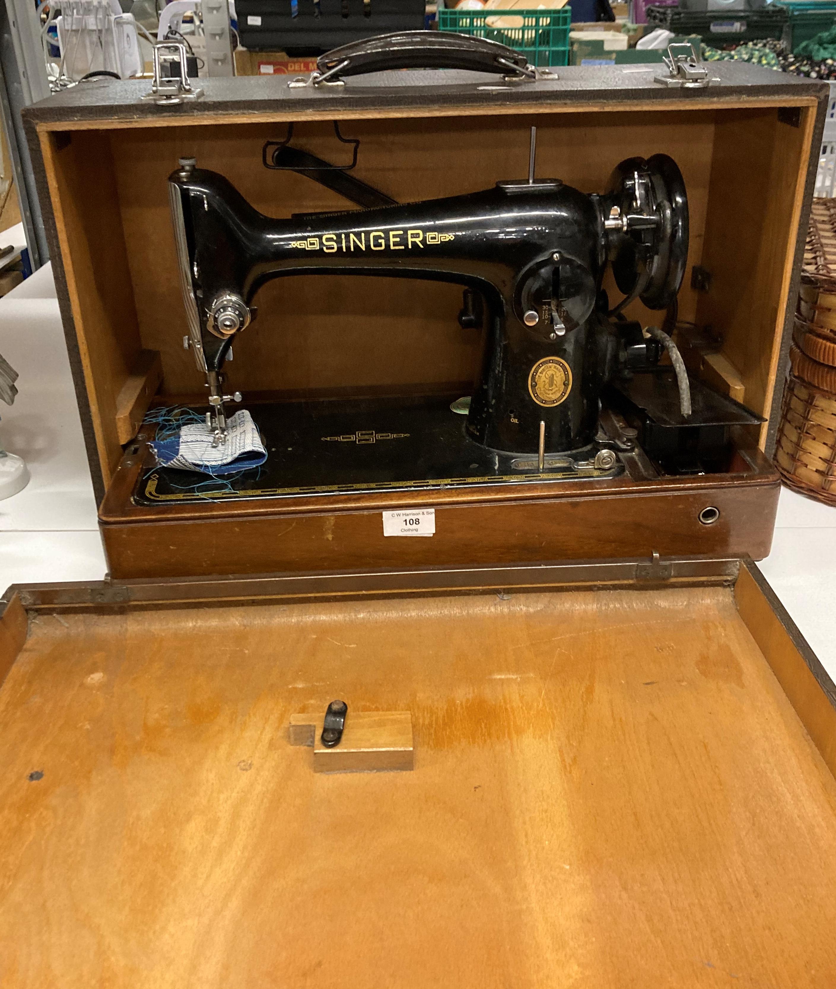 A Singer 240v sewing machine in carrying case, serial no.