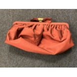 Satin-style red Coast evening bag with unique bow and gold-tone hardware fastening (saleroom