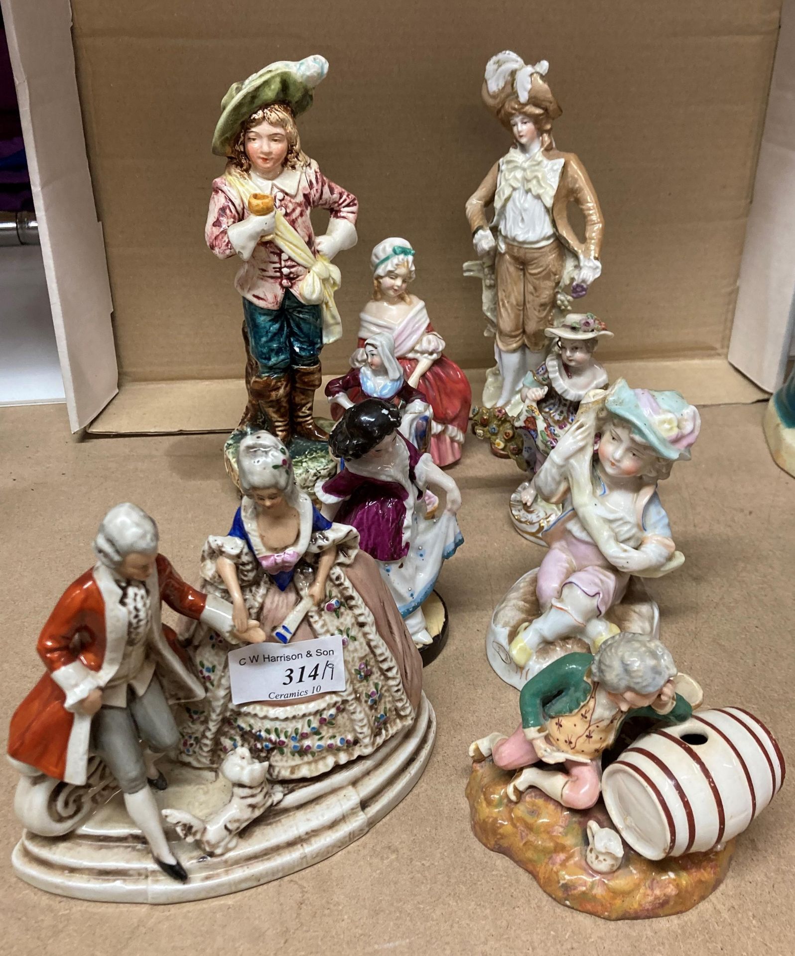 A collection of nine porcelain figures (saleroom location: Y02)