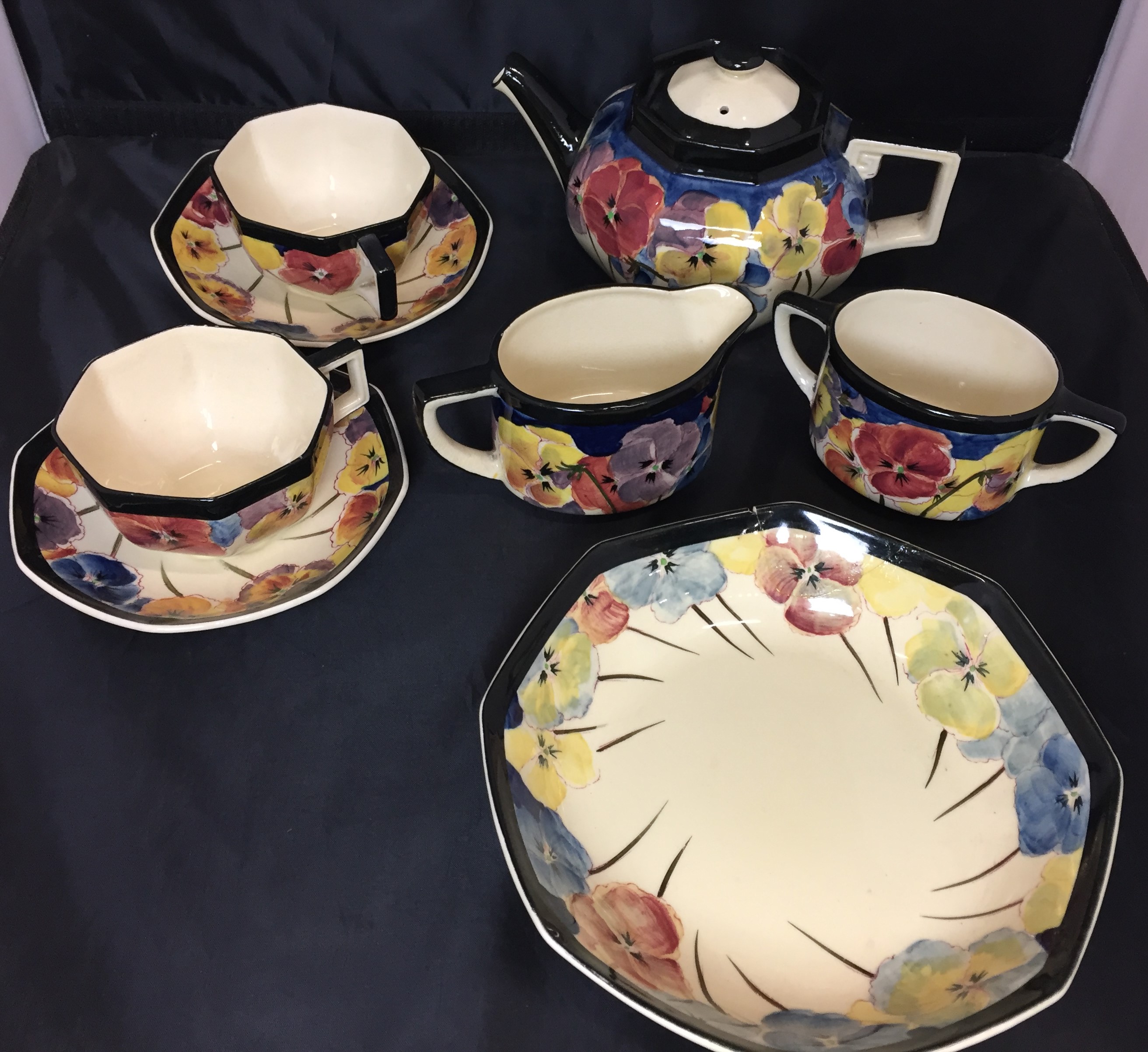 Eight items - Royal Doulton circa 1925 octagonal pansy design on cream background edged in black