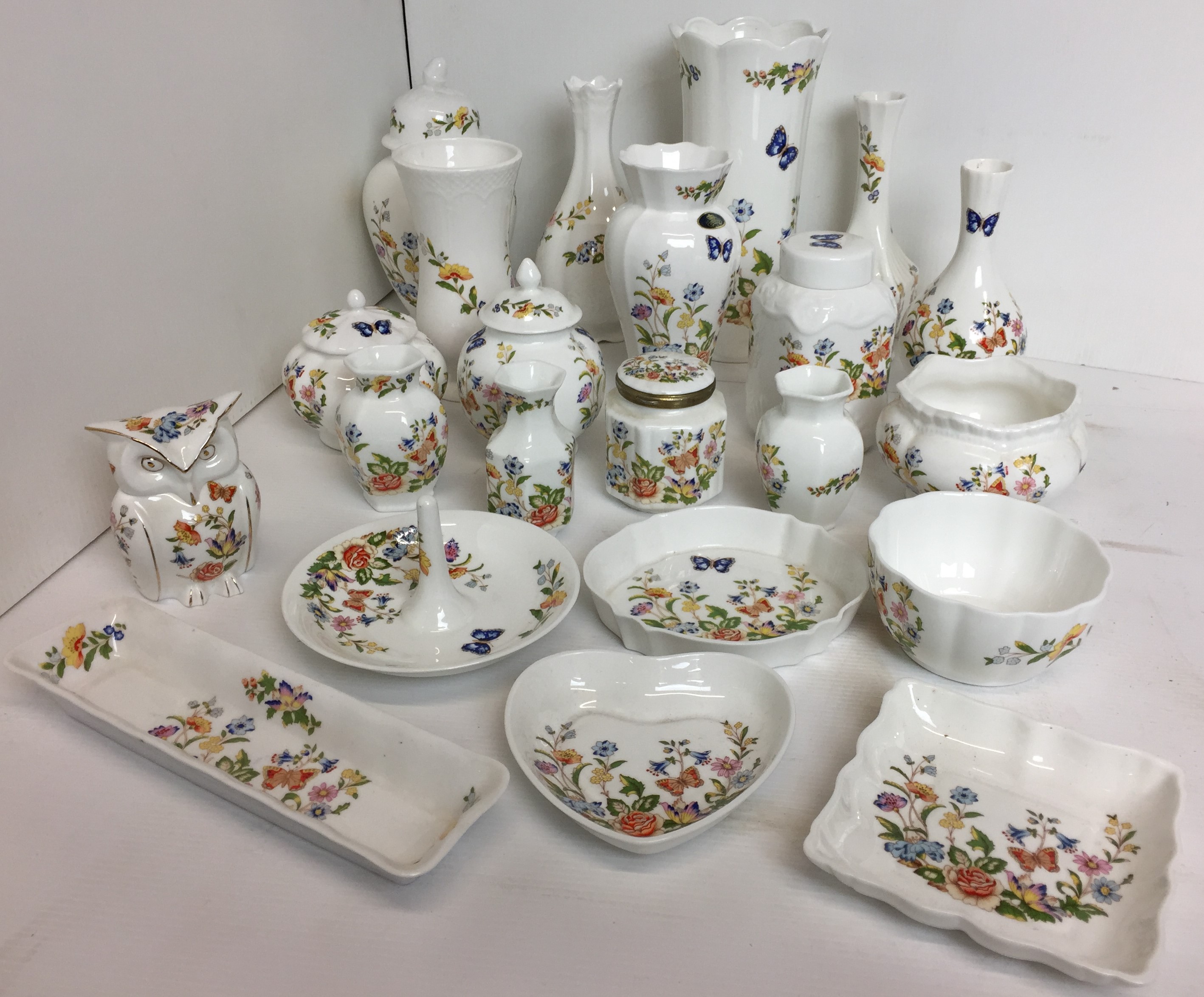 Twenty one pieces of Aynsley Cottage Garden including vases 8 to 22cm high and lidded Owl jar 9cm