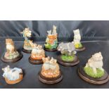 Black lid containing nine Country Artists cats 3 to 9cm high (saleroom location: X11)