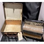 A small Hohner Preciosa accordion in carry case