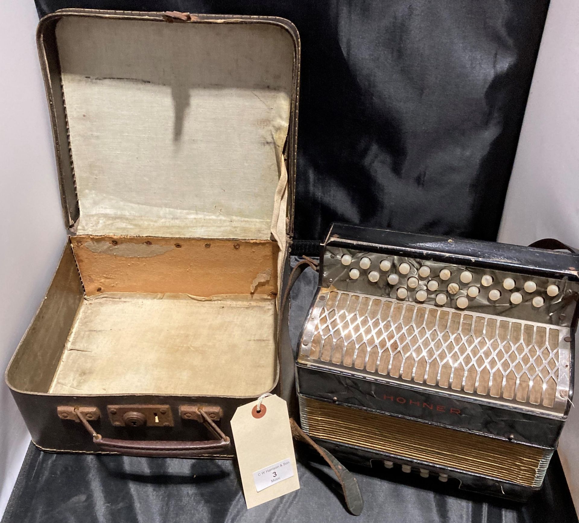 A small Hohner Preciosa accordion in carry case