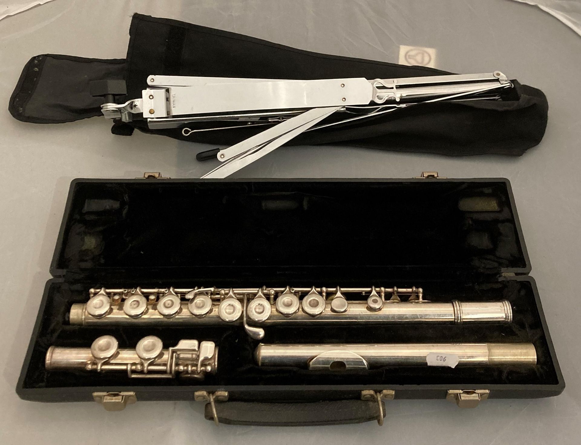 King Cleveland 610 flute in hard black case and a collapsible sheet music stand in black fabric