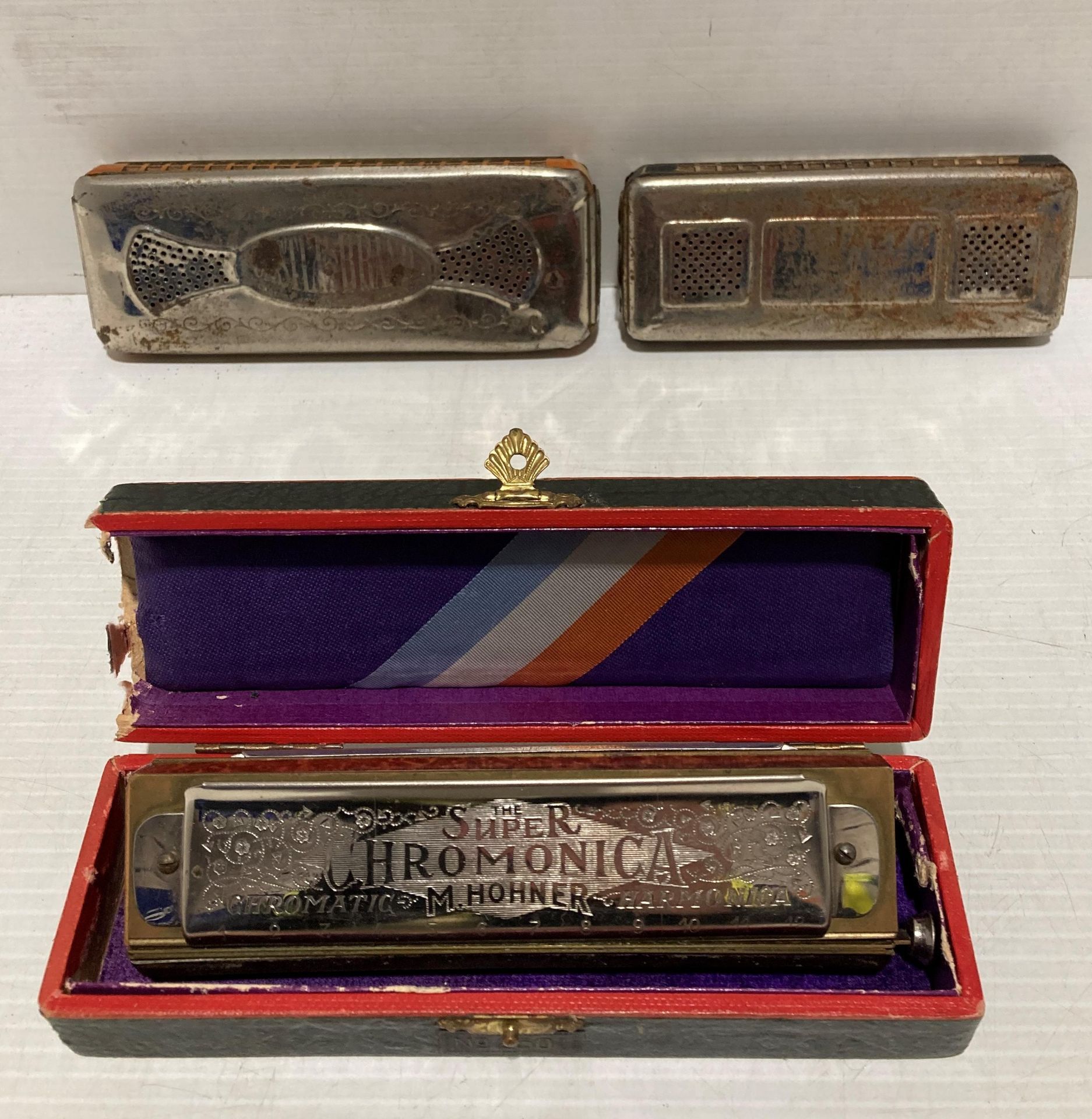 Contents to small tray - a Hohner The Super Chromonica Harmonica in box and two other German