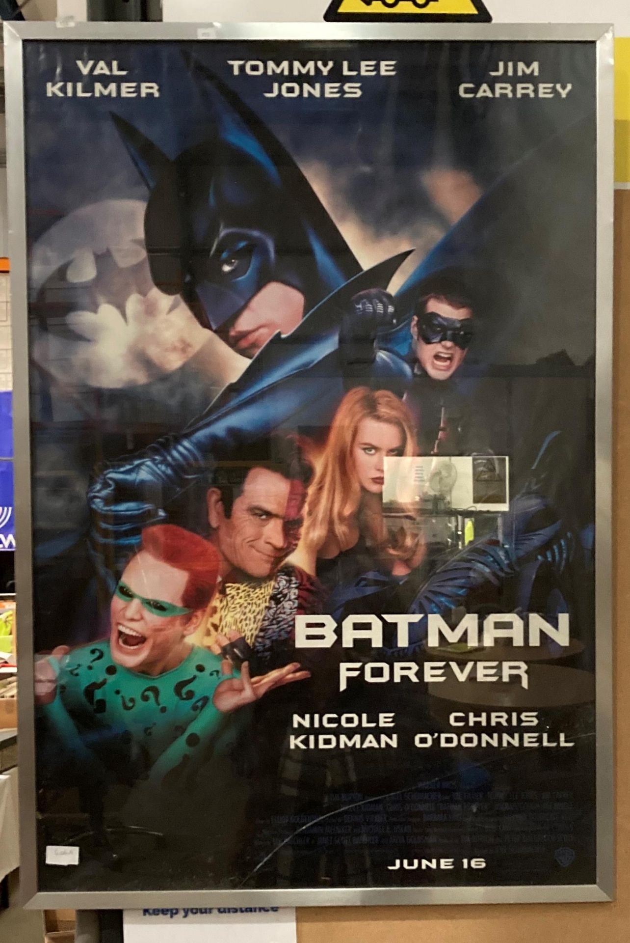 A framed film poster 'Batman Forever' 100cm x 70cm - glass cracked to bottom (Saleroom location: