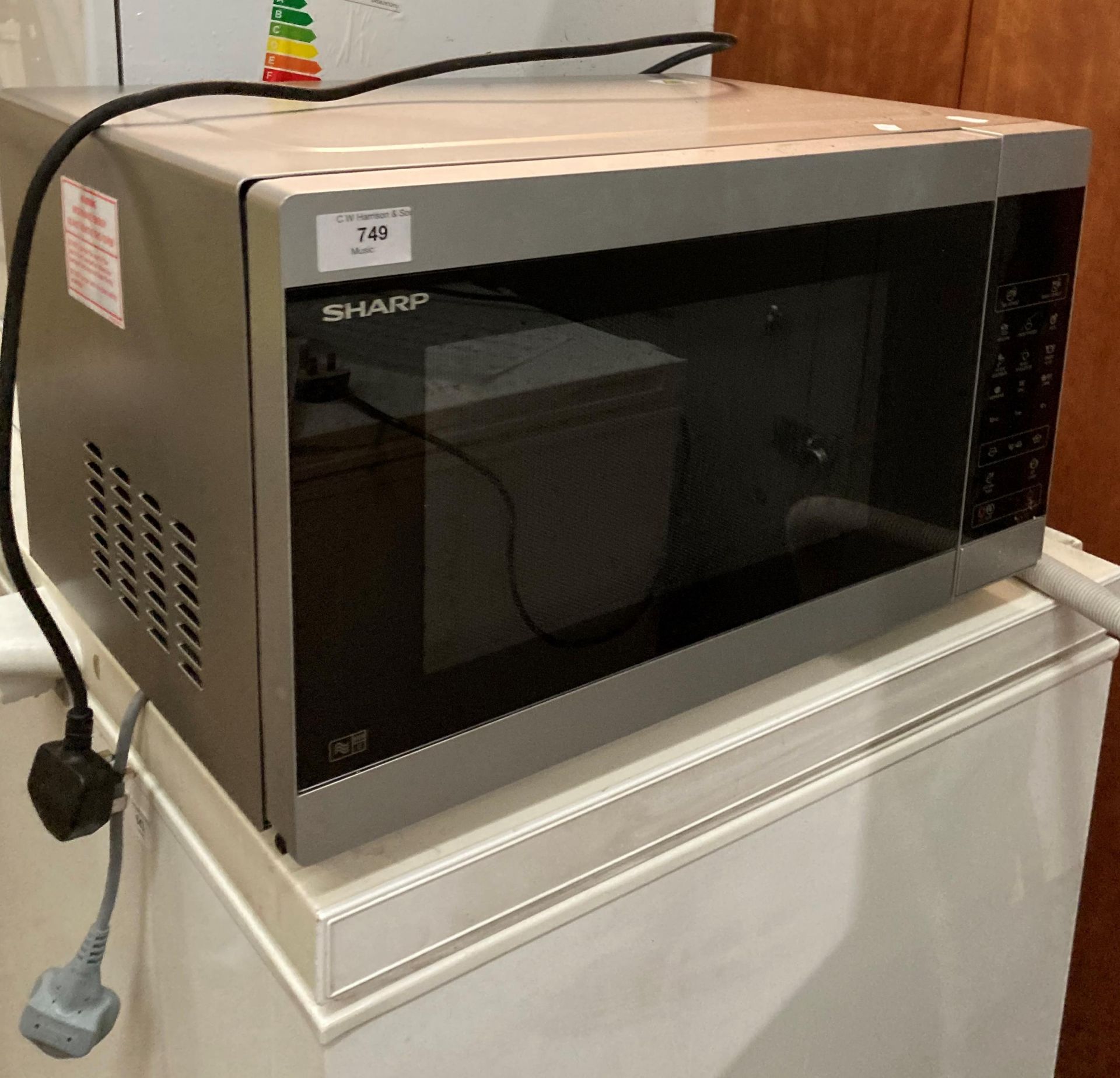 A Sharp YC-MG514-5 microwave oven (saleroom location: P0)