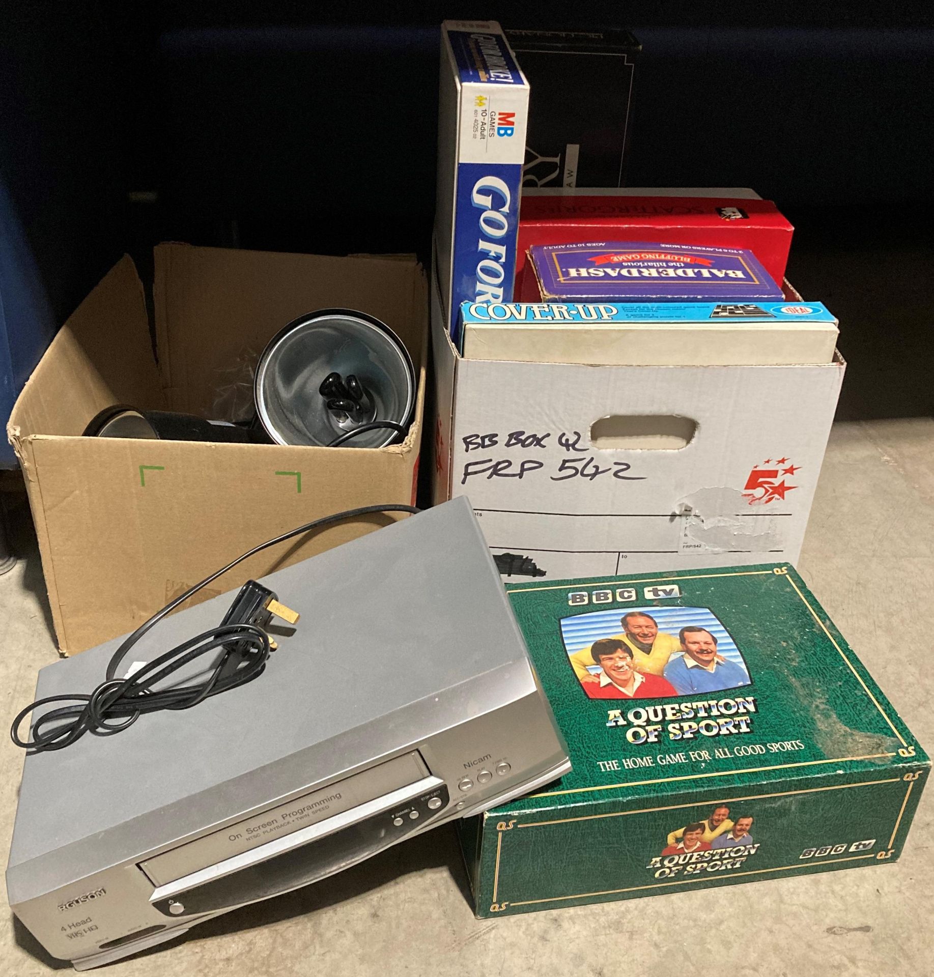 Contents to two boxes - six assorted board games, VHS player,