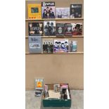 A box containing a number of books relating to The Beatles including The Beatles Anthology,