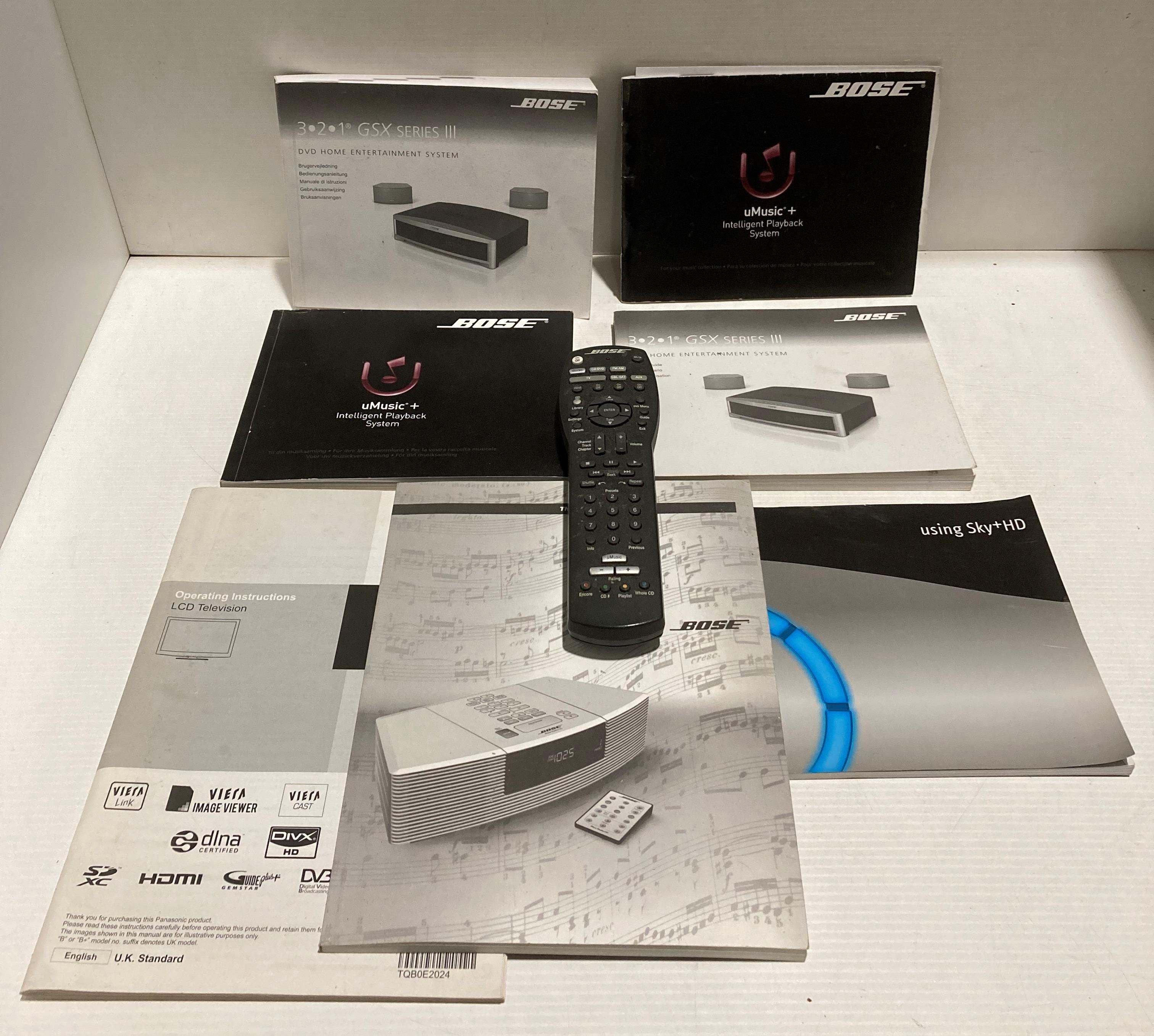 Bose remote control and a quantity of manuals (Saleroom location: S2)