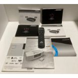 Bose remote control and a quantity of manuals (Saleroom location: S2)