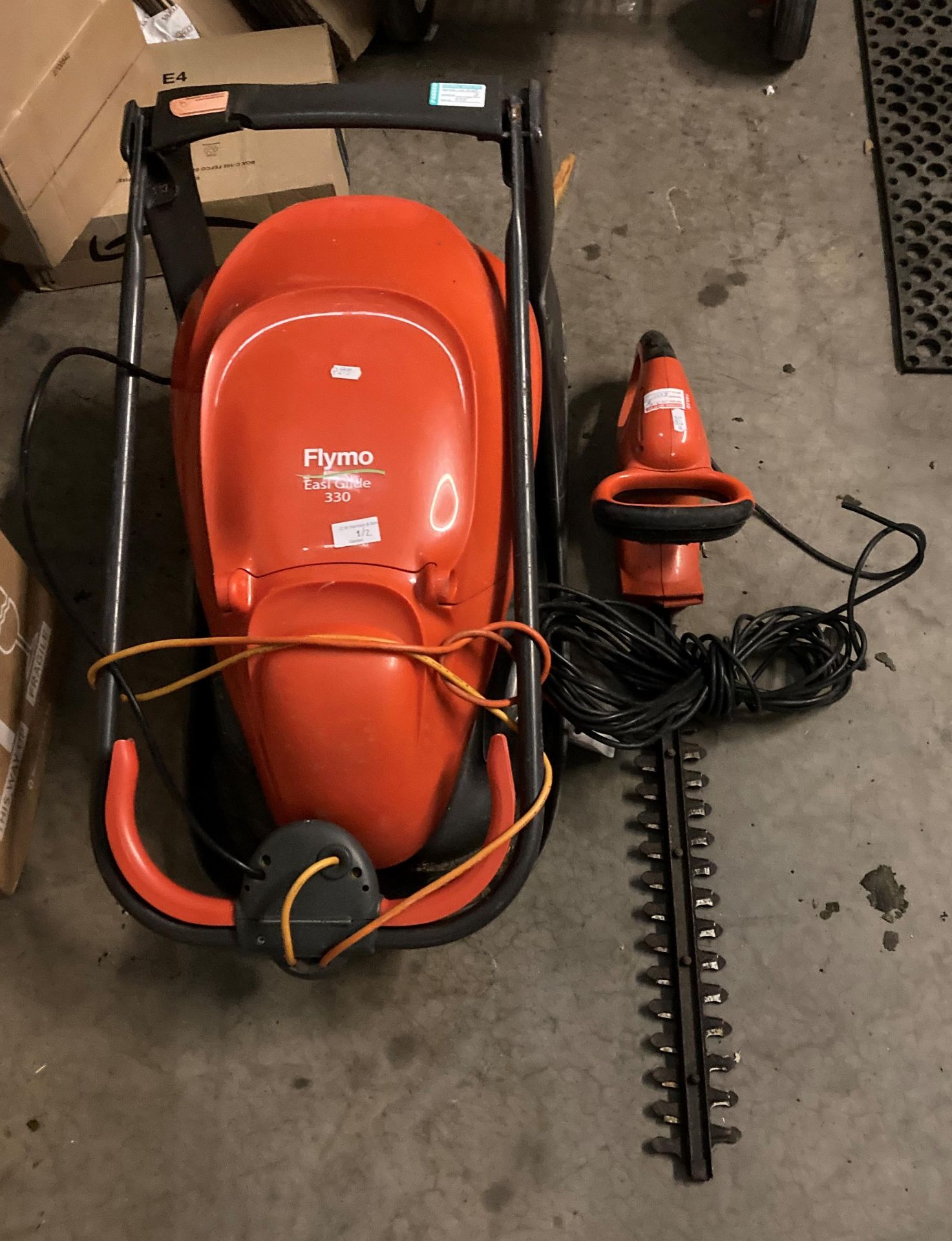 A Flymo Easi Glide 350, 240v hover mower complete with collection box and a Flymo 450,