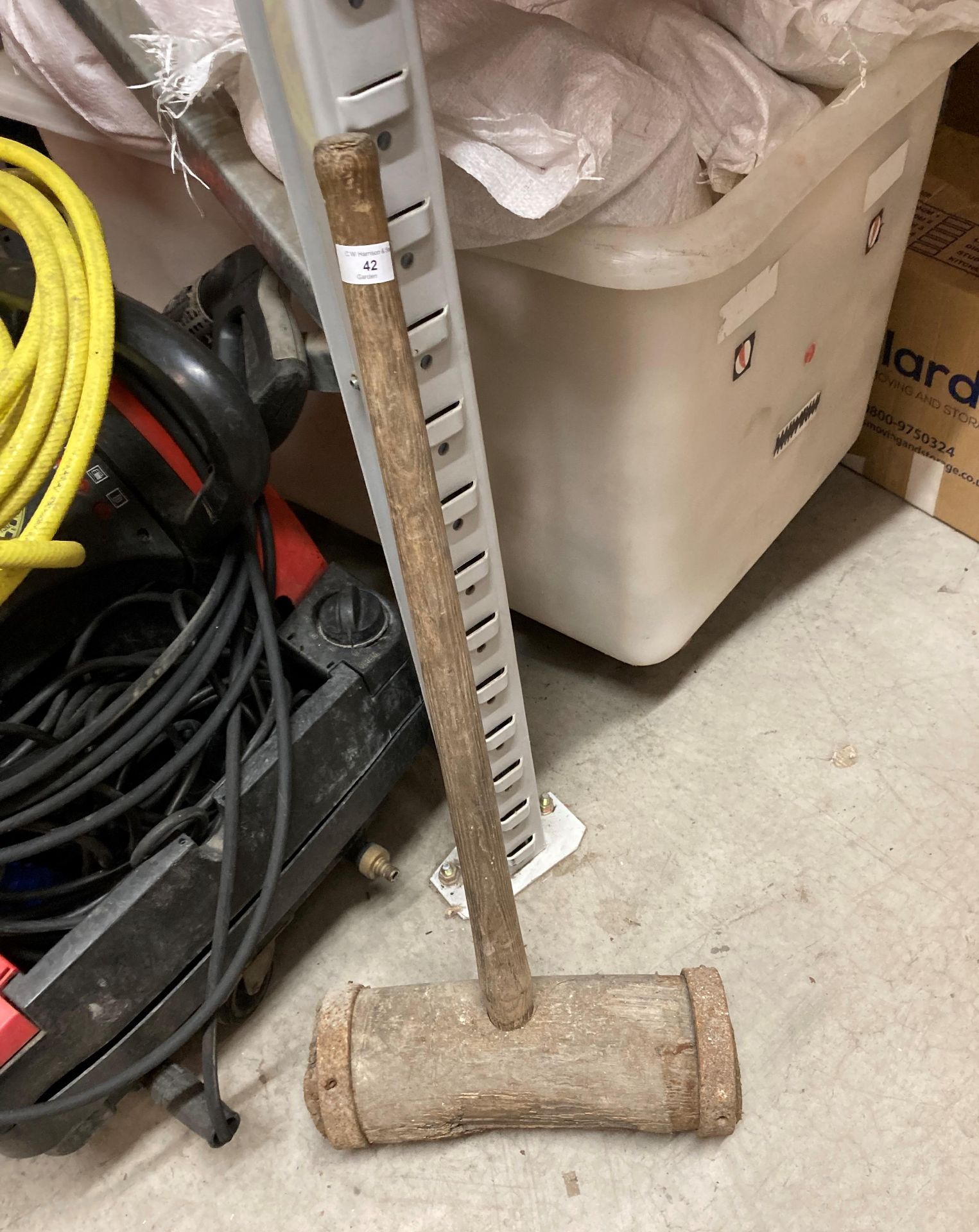 A large wooden mallet (saleroom location: Y02 floor)