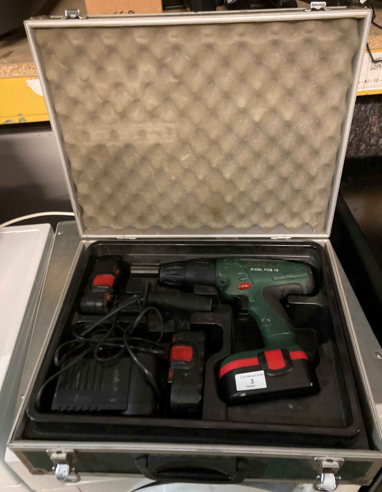 A Bosch X-Cel PSB 18 cordless drill complete with charger and three batteries in carry case