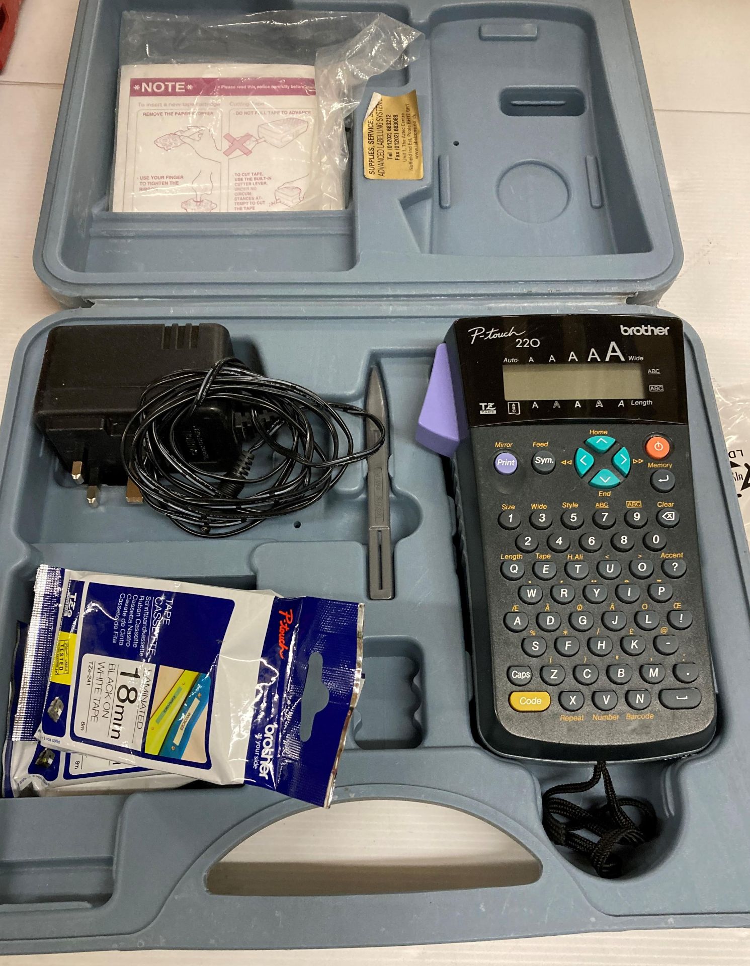 Brother P-touch 220 label printer complete with charger in case (saleroom location: H07)