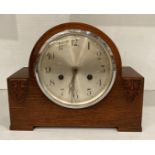 Mahogany mantel clock with circular face, no pendulum or hammer, etc.