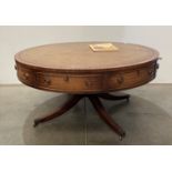 Reprodux large drum table, model V629LS, with brown tooled leather top,