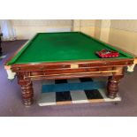 A full size snooker table by J Ashcroft & Co, Liverpool, badged, complete with cover, rests, balls,