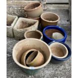 A pair of concrete corner troughs and ten various colour-glazed planters (12) (please note: does