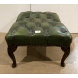 Green leather deep button footstool on dark wooden cabriole legs,