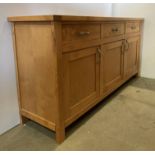 Light oak finish three drawer, three door sideboard,