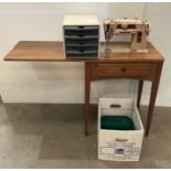 Singer 401 sewing machine in a mahogany cabinet together with a box of assorted sewing thread,