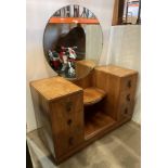 Walnut Art Deco style six drawer dressing table with central shelf and circular mirror,